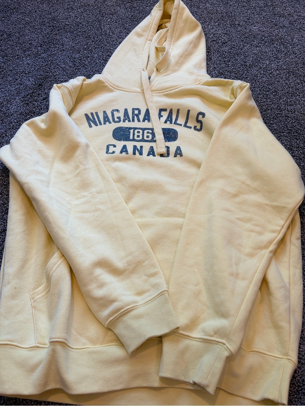 Bwear Cream Hoodie with Blue Niagara Falls Canada Graphic
